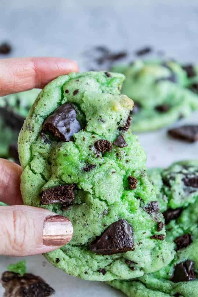 hand holding a green mint cookie with thin mints