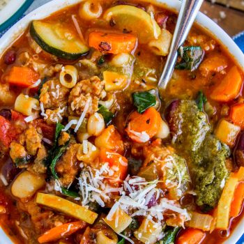 minestrone soup in a bowl with a spoon