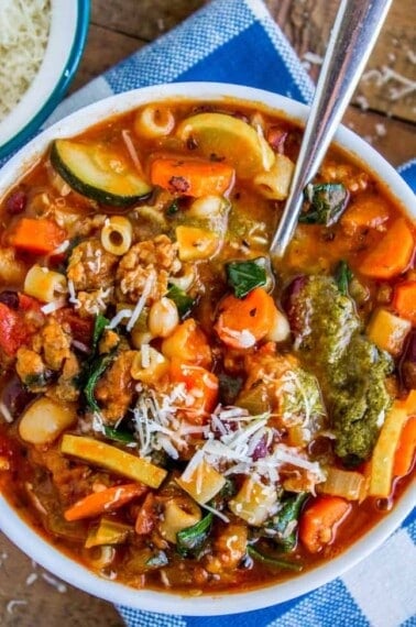 minestrone soup in a bowl with a spoon