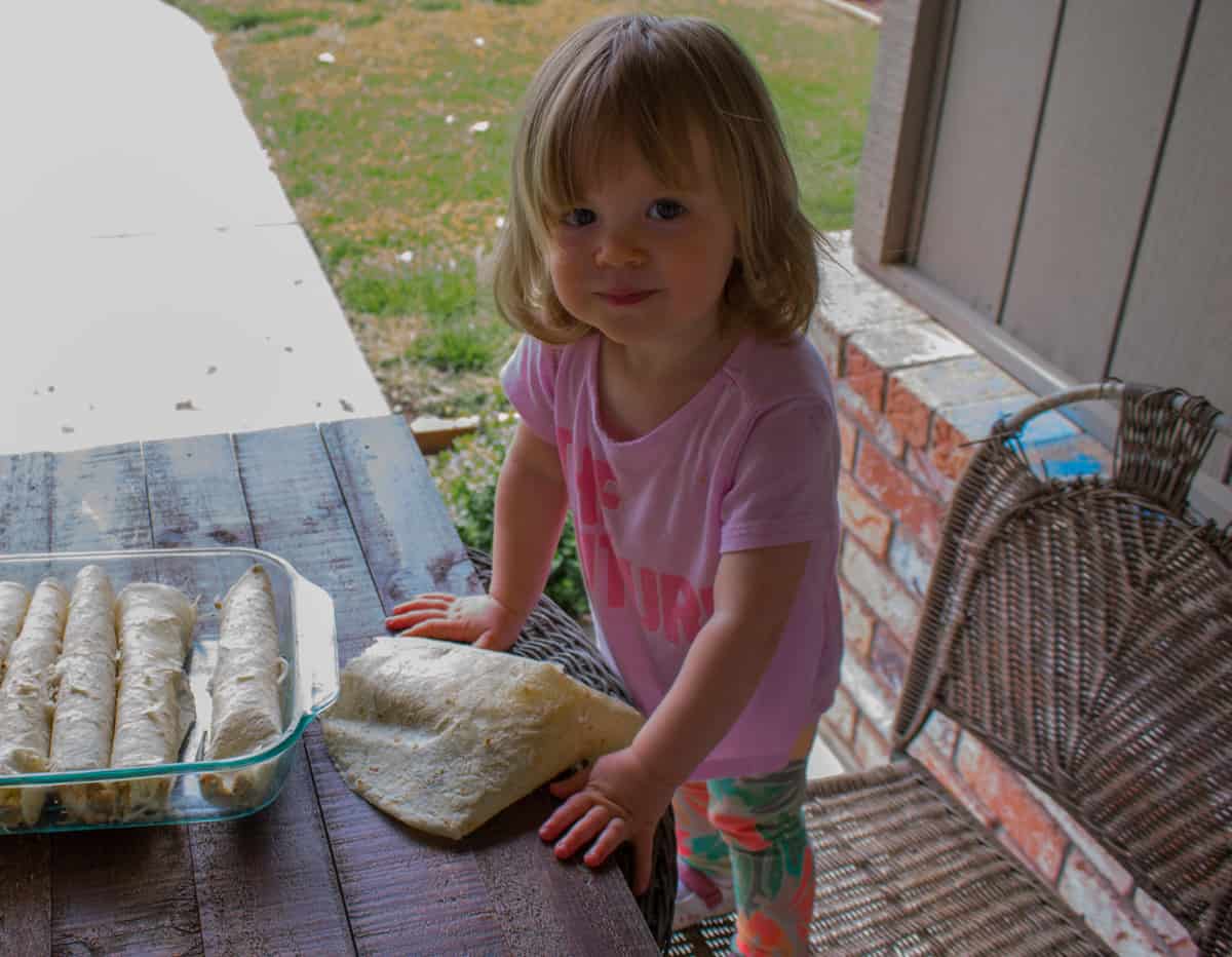 girl eating enchiladas