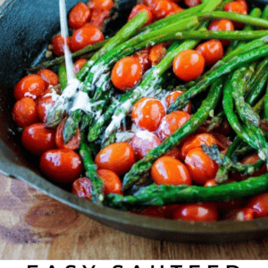 a cast iron skillet with sauteed asparagus and cherry tomatoes and cream added.
