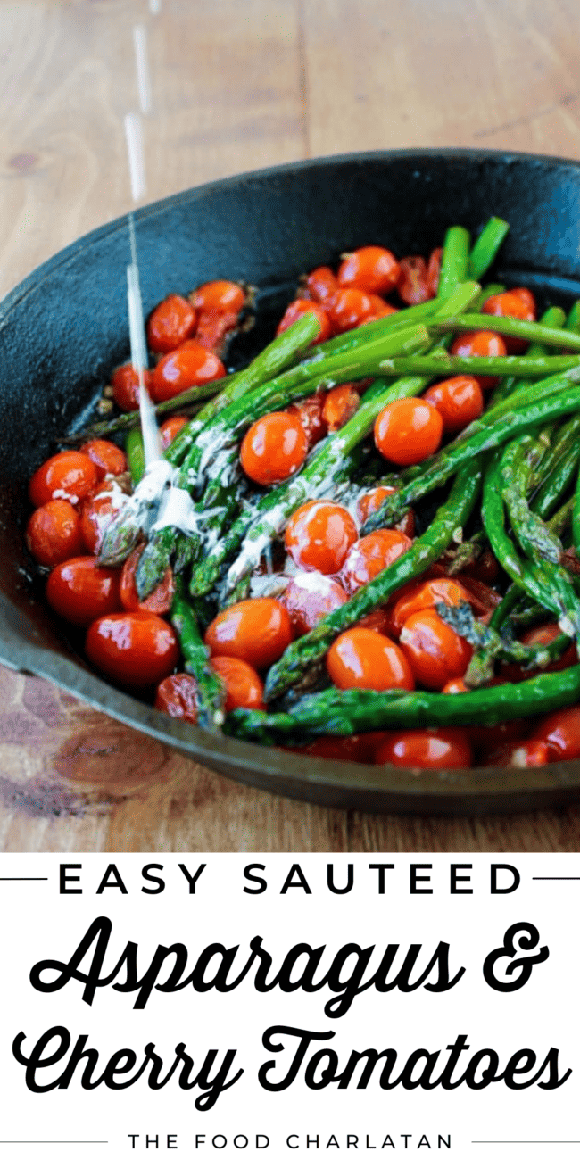 a cast iron skillet with sauteed asparagus and cherry tomatoes and cream added.