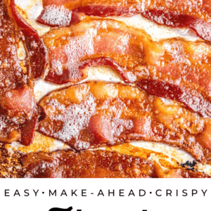 baked bacon lined up on a baking sheet