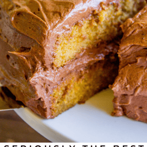 A slice of yellow cake with rich chocolate frosting is being lifted from the rest of the cake. Text below reads: Seriously delicious yellow cake. The Food Charlatan.