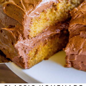 A close-up of a homemade yellow layer cake with chocolate frosting, sliced to reveal the moist interior. Text overlay reads: Classic Homemade Yellow Cake with a Special Ingredient! The Food Charlatan, perfect for celebrations.