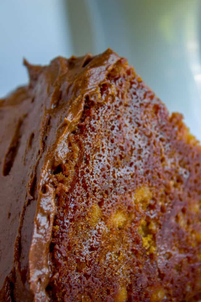 the bottom of a chocolate frosted yellow cake.