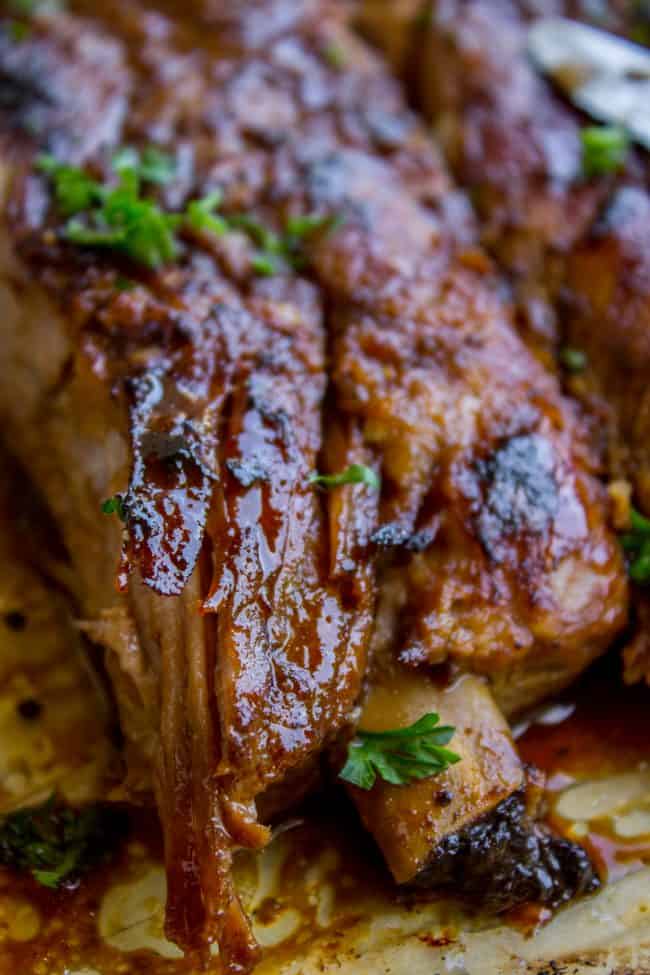 closeup of slow cooker spare ribs garnished with fresh herbs