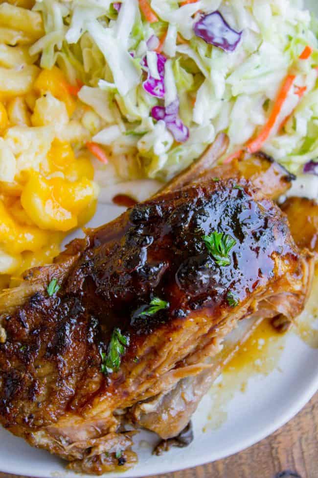 overhead of a chunk of pork rib on a plate with coleslaw