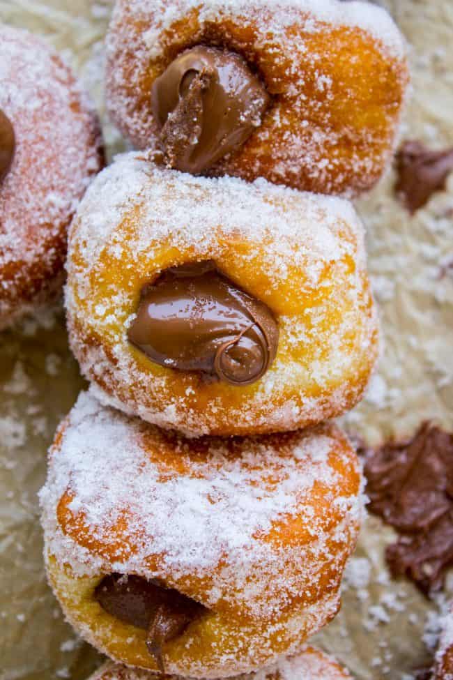 a stack of donuts showing nutella filling