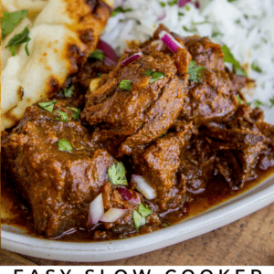 A plate of beef curry garnished with cilantro, served with white rice, red onions, and naan bread. The bottom text reads: Easy Slow Cooker Weeknight Beef Curry. The Food Charlatan. Perfect for cozy nights in.
