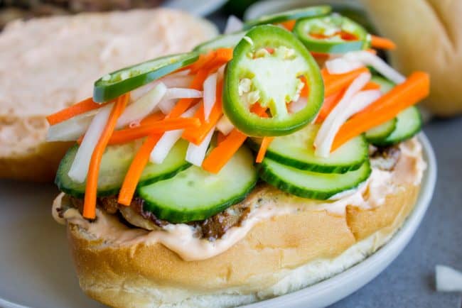 pork banh mi with the top bun open.