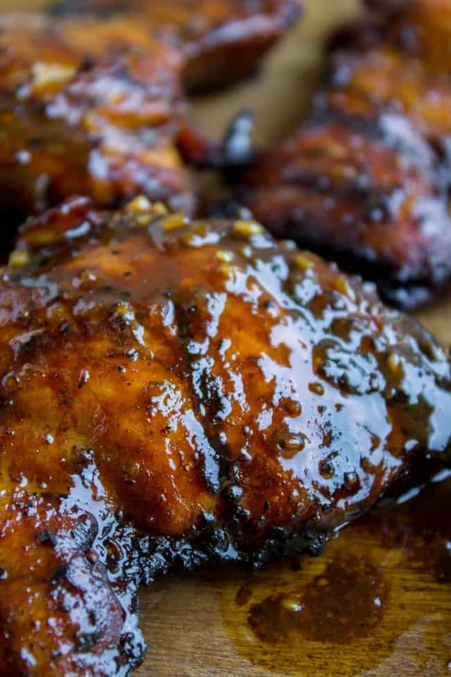 grilled chicken on a wooden cutting board. 