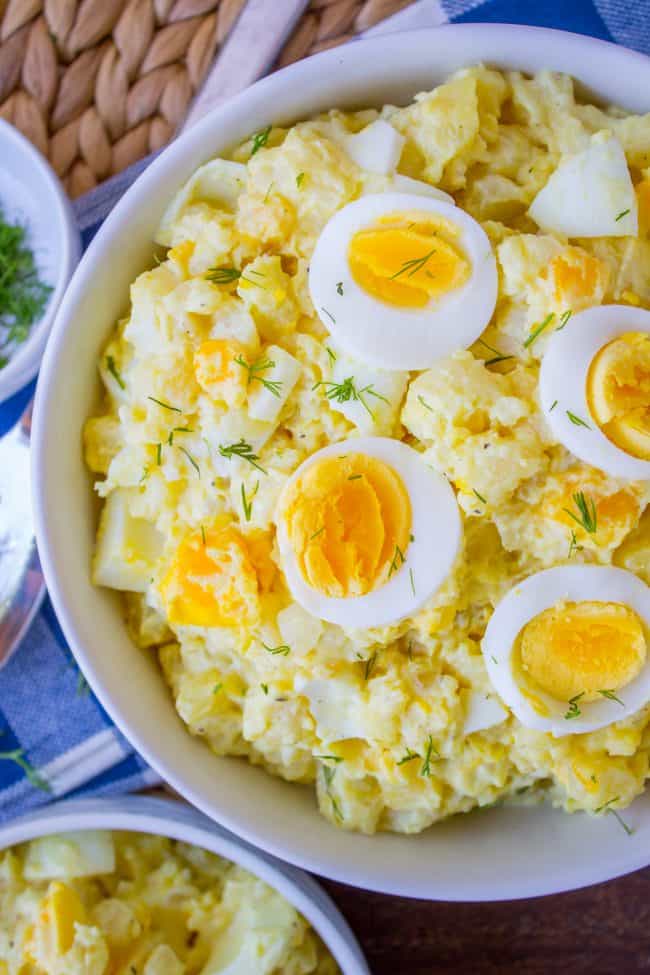 potato salad with hard boiled eggs and fresh dill. 