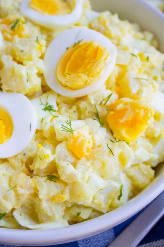 potato salad with hard boiled eggs and fresh dill. 