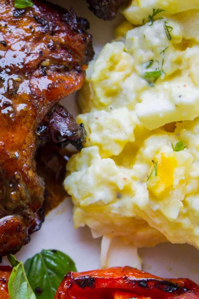 potato salad next to homemade ribs.