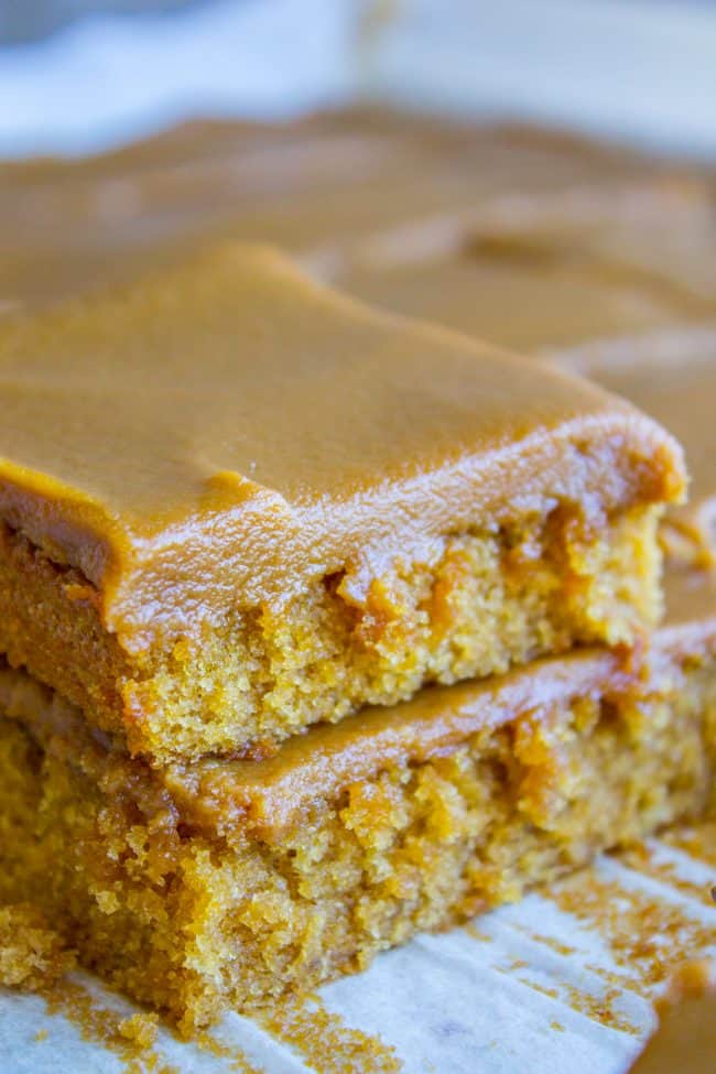 Squares of cake covered in thick frosting made from this caramel frosting recipe