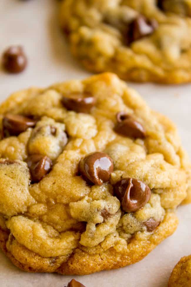 soft chewy chocolate chip cookies with chips melting on top.