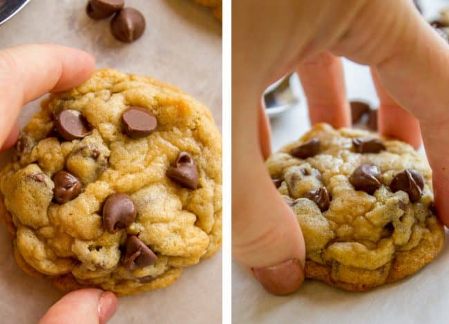 adding additional chocolate chips to the top of a freshly baked chocolate chip cookie and picking it up.