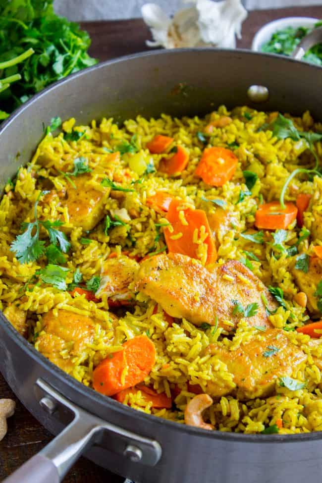 Chicken biryani in a skillet.