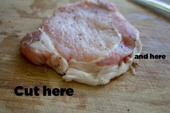 Cutting fat off pork chops