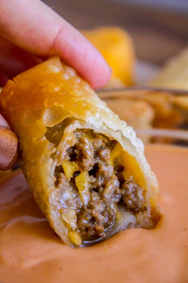 dipping a cheeseburger egg roll in fry sauce.