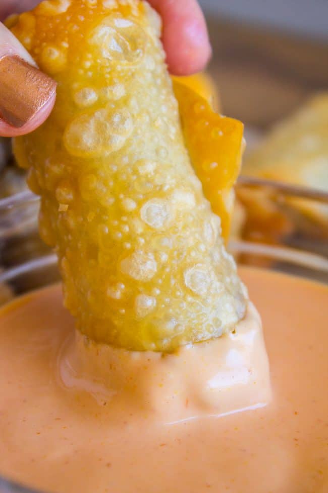 dipping a cheeseburger egg roll in fry sauce. 