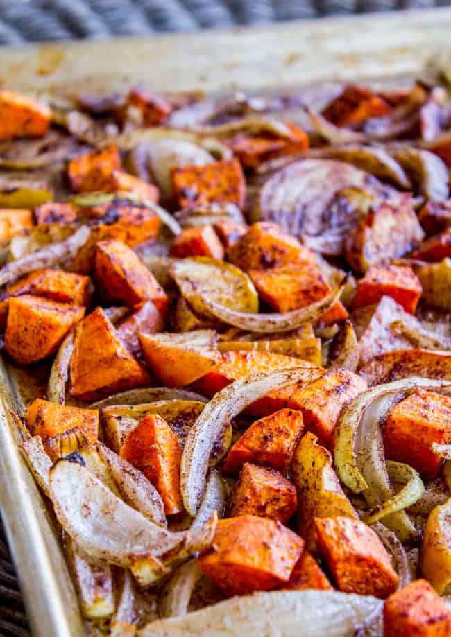 roasted apples and veggies on a sheet pan.