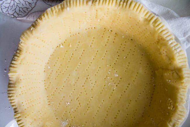 docked pie crust, pricked all over with a fork.