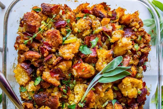 bacon cornbread stuffing with fresh sage in a glass baking pan.