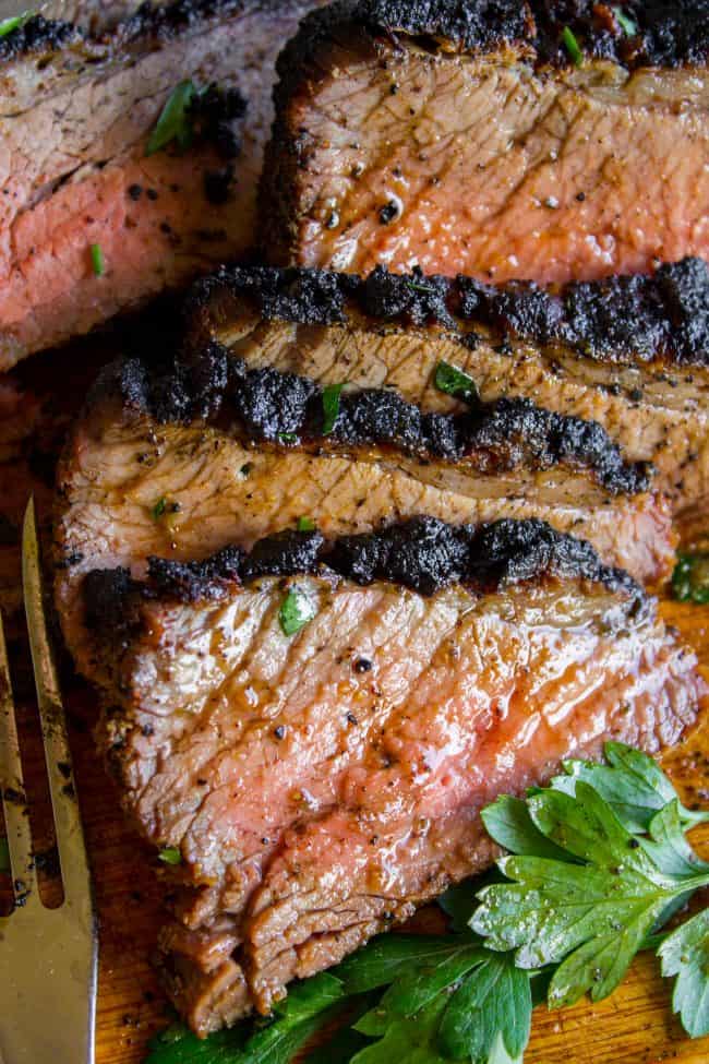 close up shot of sliced juicy tri tip roast with a beautiful crust.