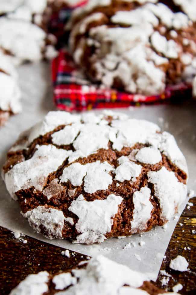 chocolate crinkle cookie on parchment paper.