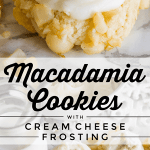 Close-up of macadamia nut cookies topped with swirled cream cheese frosting, some sprinkled with black specks. Several frosted macadamia nut cookies are arranged on a marble surface near a glass of milk. Text reads: Macadamia Cookies with Cream Cheese Frosting.