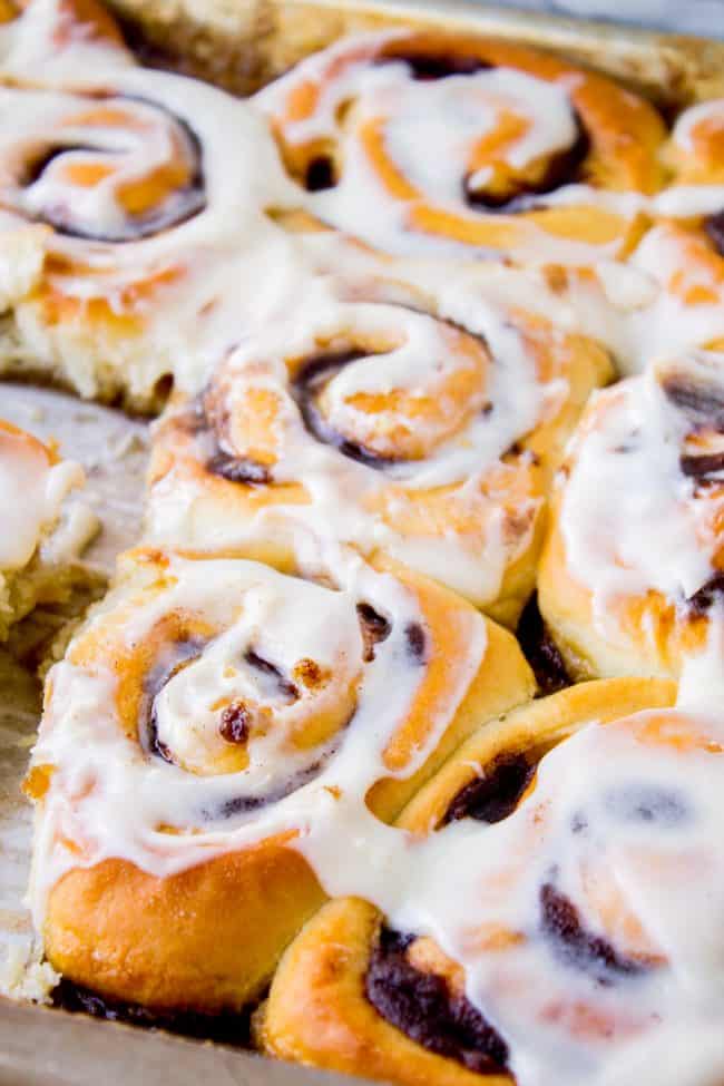 gooey cinnamon rolls on a pan.