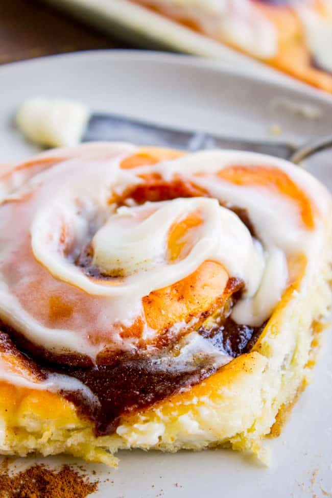 cinnamon roll showing swirl of frosting on top.