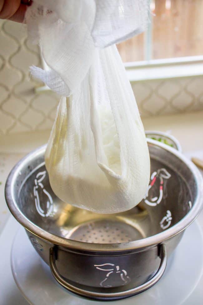 straining yogurt for tzatziki sauce recipe.