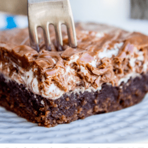 a fork in a slice of Mississippi mud cake.