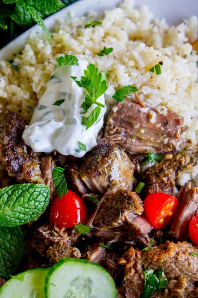 shredded gyro beef with cauliflower rice, Tzatziki sauce, fresh veggies, and herbs.