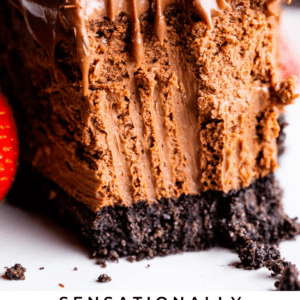 chocolate cheesecake with a bite removed by fork.