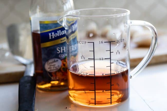 cooking sherry in a glass measuring cup.