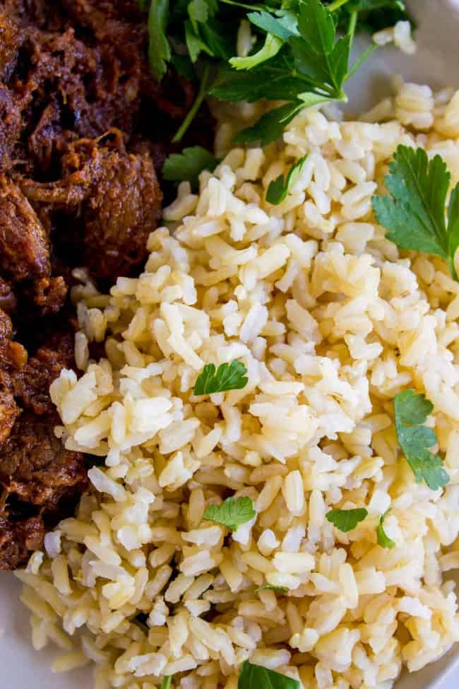 Instant pot brown rice with beef and cilantro on a plate.
