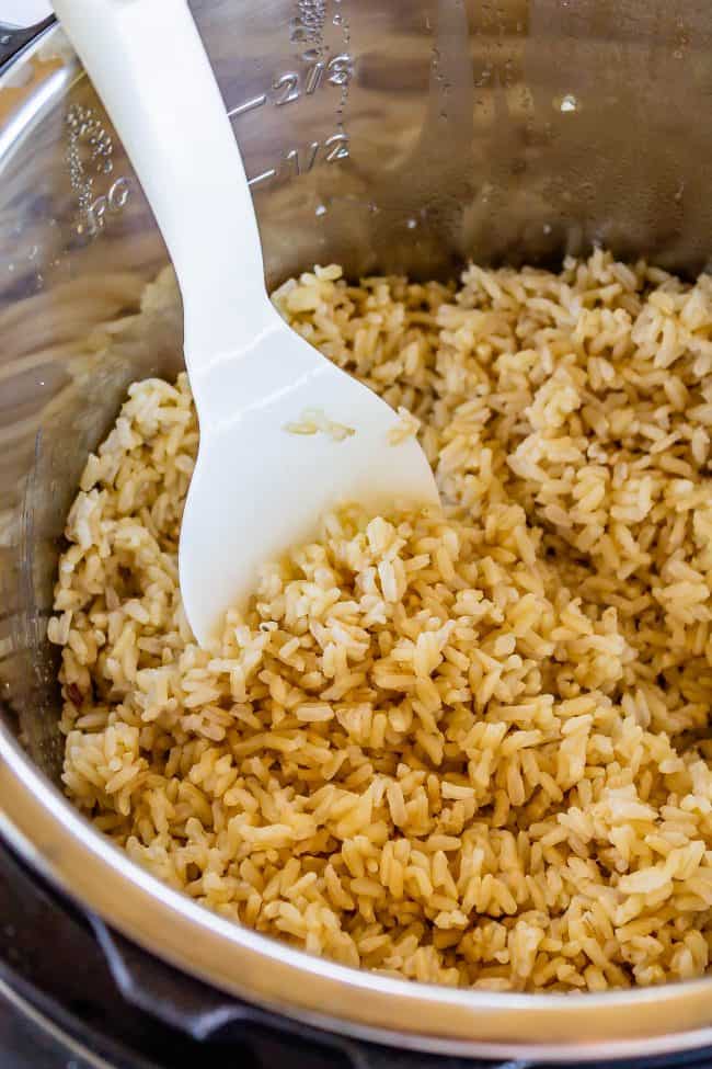 brown rice in instant pot with rice paddle.