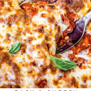 Close-up of a cheesy ravioli lasagna topped with fresh basil leaves, with a spoon and spatula serving a portion. Text at the bottom reads “Easy & Cheesy Ravioli Lasagna – The Food Charlatan.”