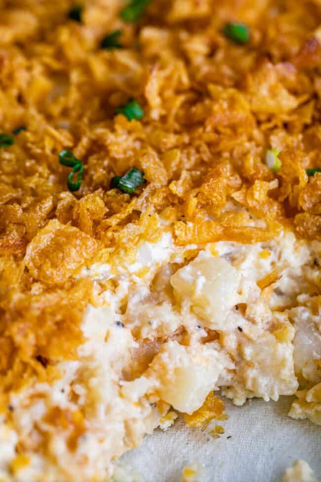 cheesy potatoes topped with corn flakes  and parsley.