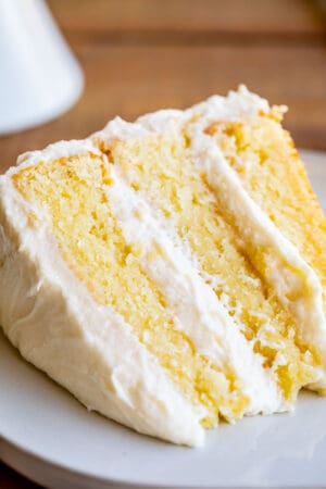 close up of triple layered simple white cake recipe from scratch