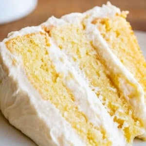 close up of triple layered simple white cake recipe from scratch