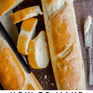 A sliced loaf of French bread rests on a wooden surface with a knife, butter, and a green cloth nearby. Text reads: One Hour French Bread - The Food Charlatan.