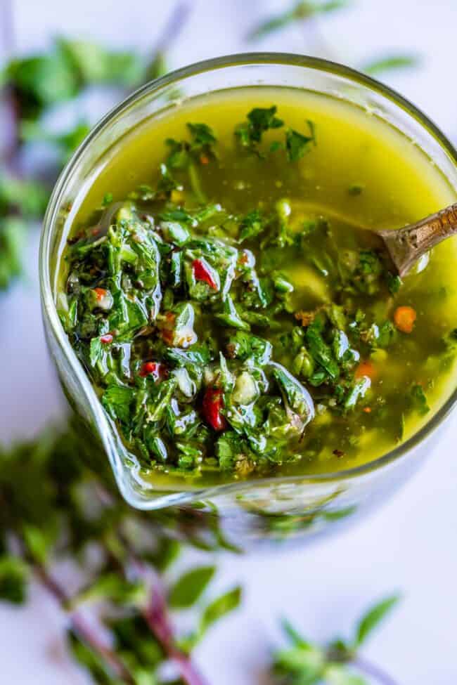 chimichurri sauce with a spoon in it. 