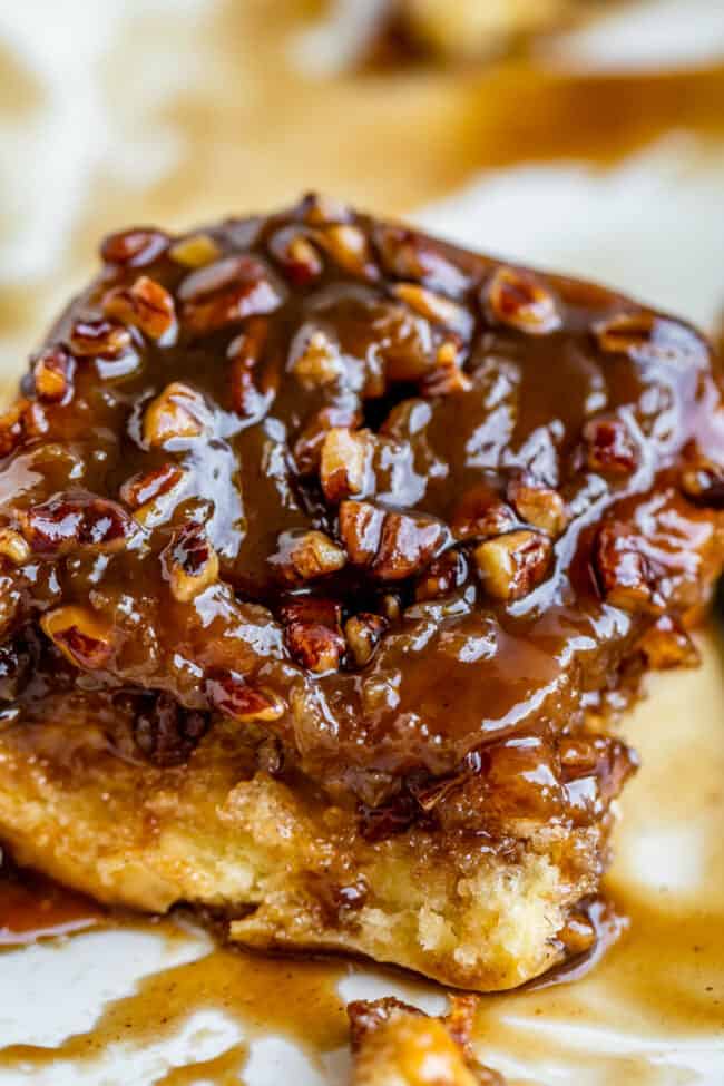 Caramel pecan roll with pecans sprinkled on top