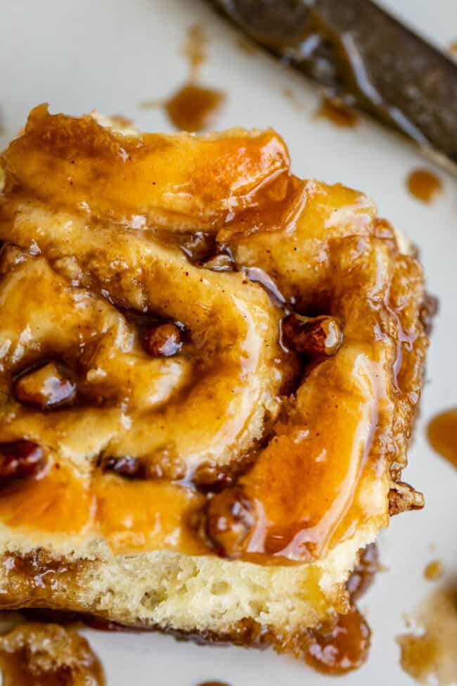 caramel pecan sticky bun close up with sauce