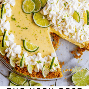 key lime pie with lime whipped cream and fresh lime slices.